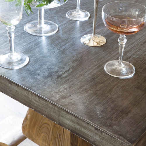 Metal top reclaimed wood dining table