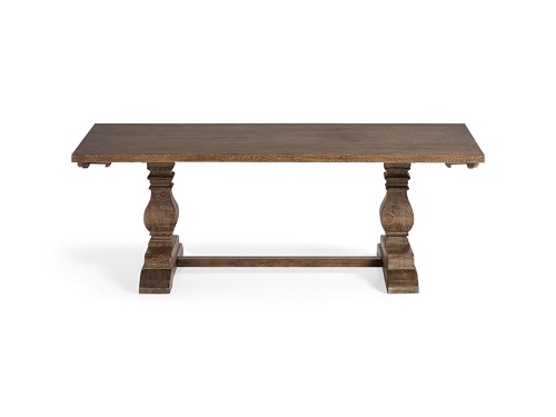 Dark stained trestle dining table